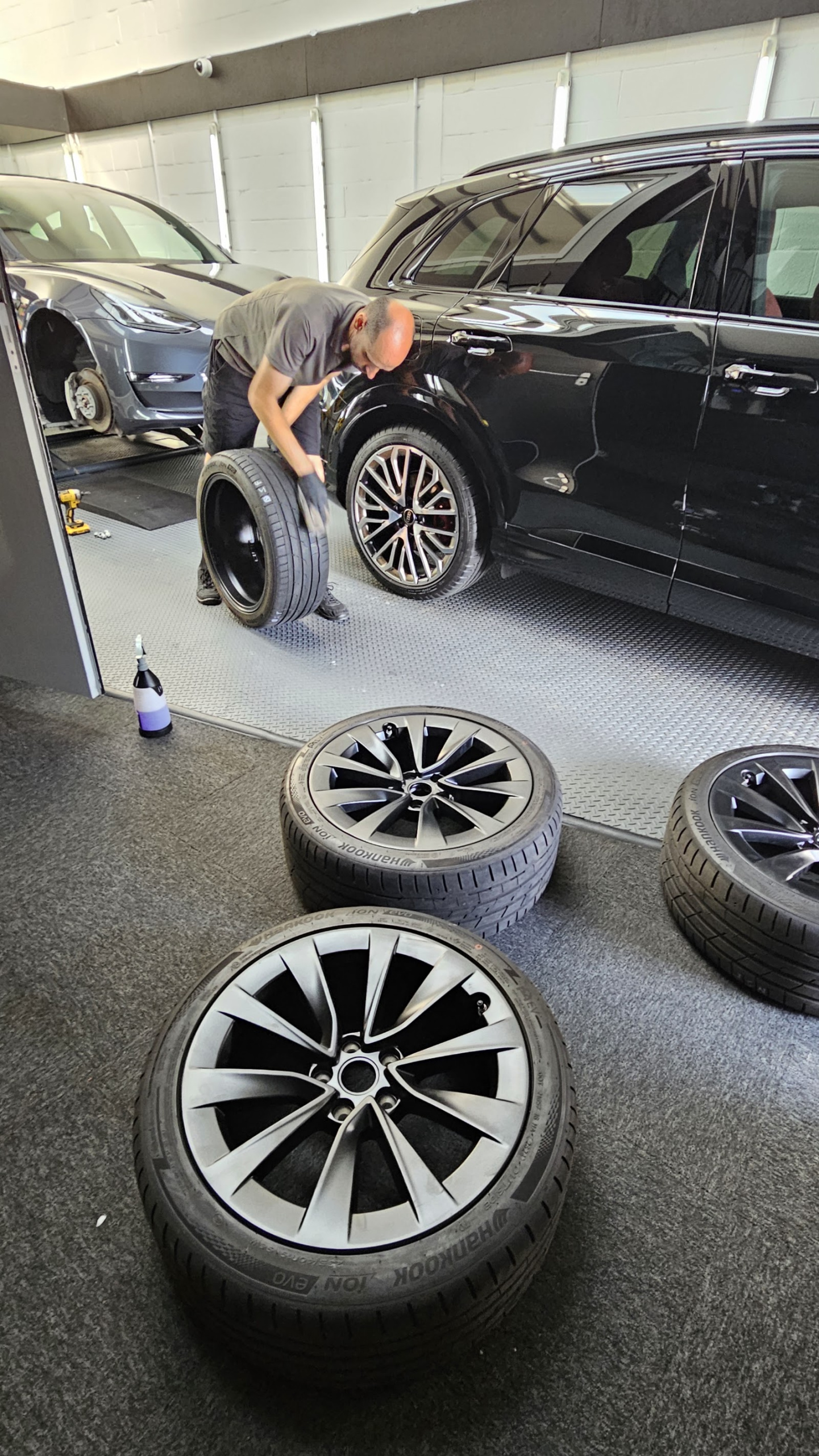 Alloy wheel refurbishment in progress - a full set off the car at the MAX WAX workshop in Shoreham
