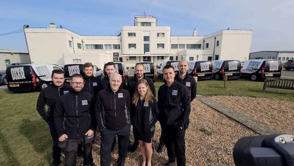 The MAX WAX team and vans outside the HQ at Brighton City Airport, Shoreham-by-Sea
