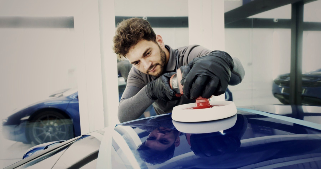 MAX WAX technician rotary machine polishing a car